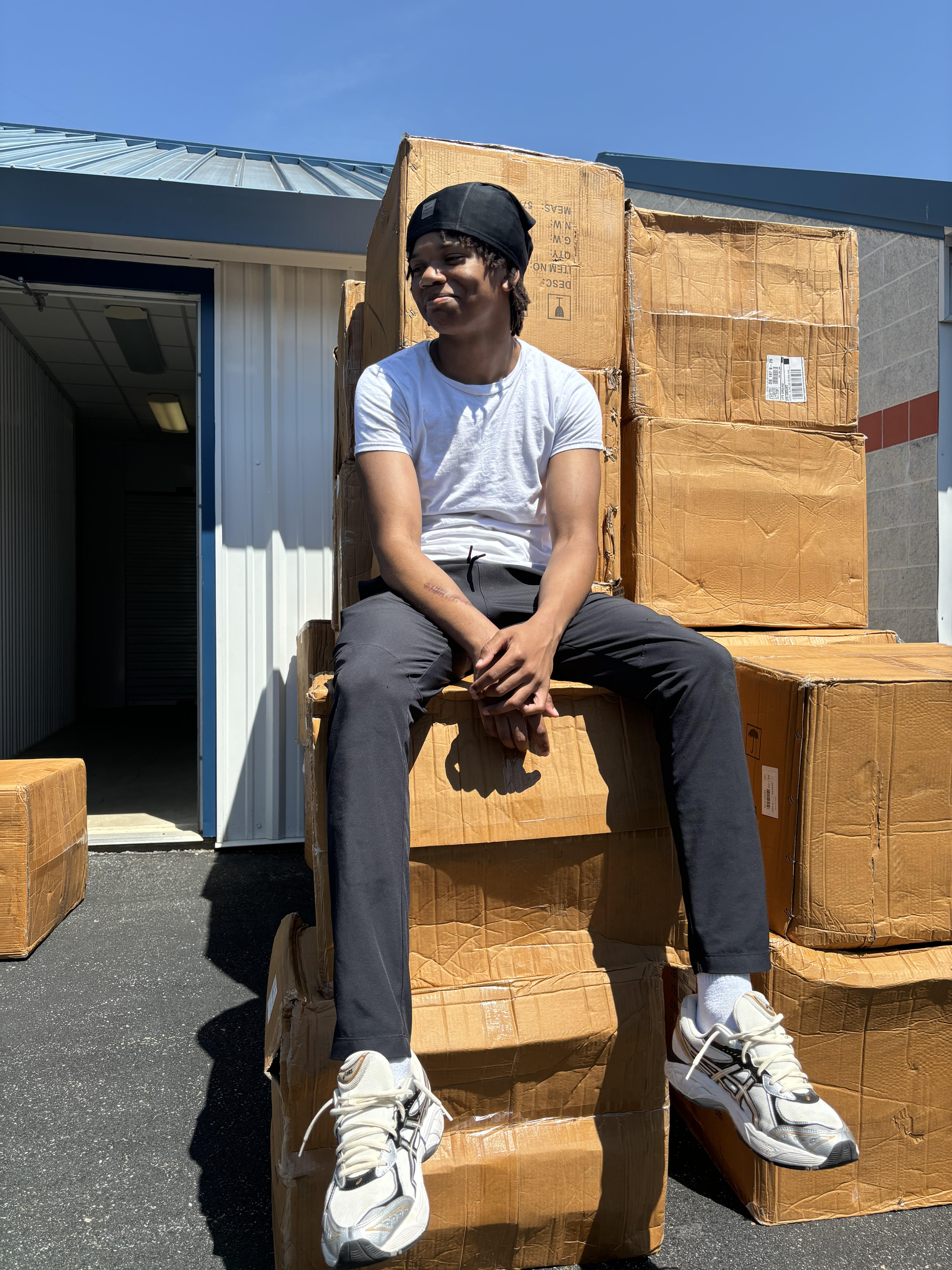 Brother at storage unit with packages
